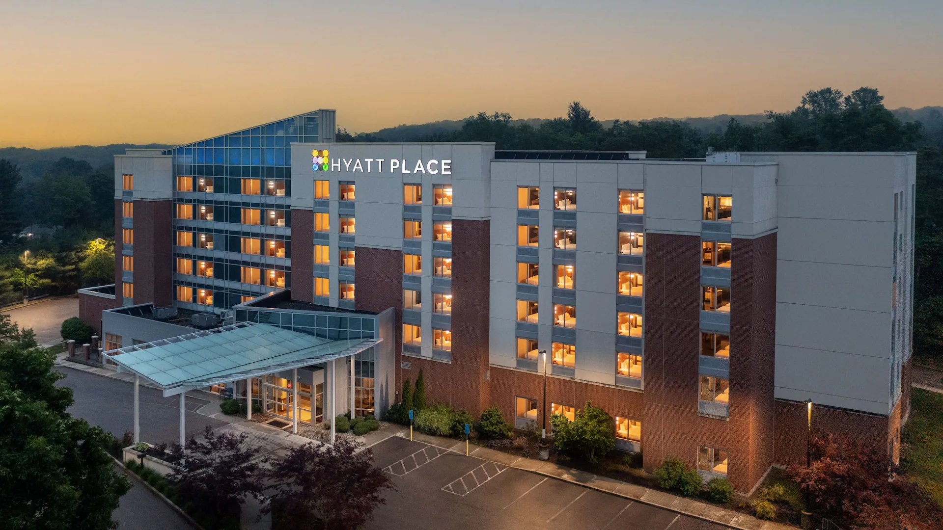 Hyatt Place hotel exterior at sunset